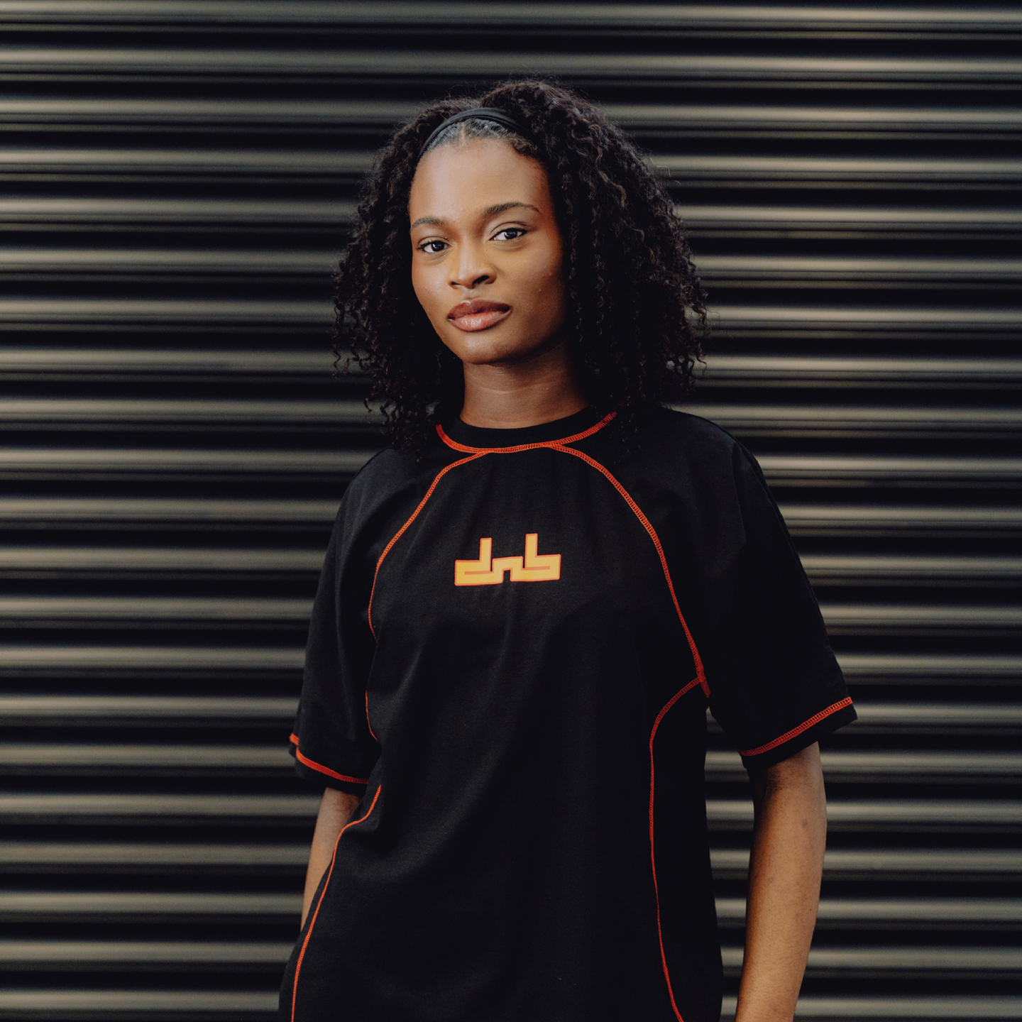 DNBA Flatlock Tee - Black/Orange